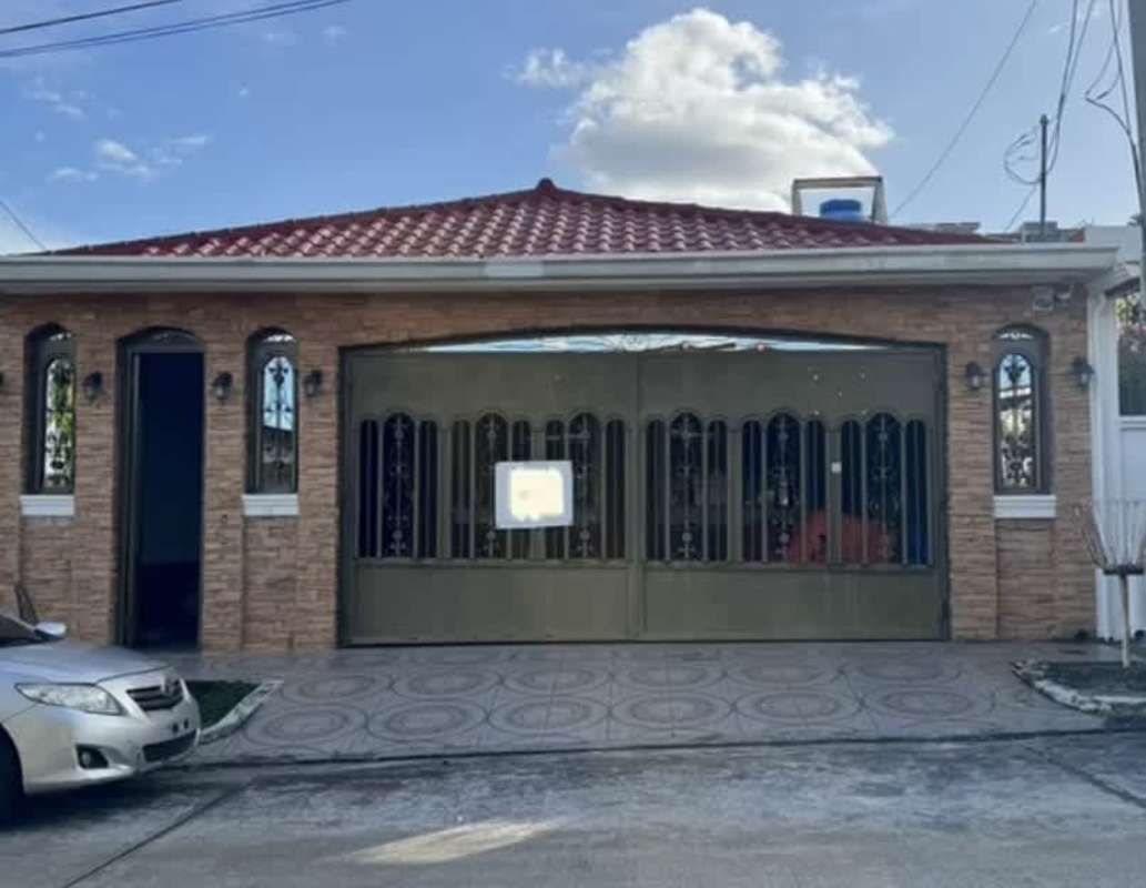 Spacious bedroom with ceramic tile flooring and built-in closet and window in Brisas del Golf