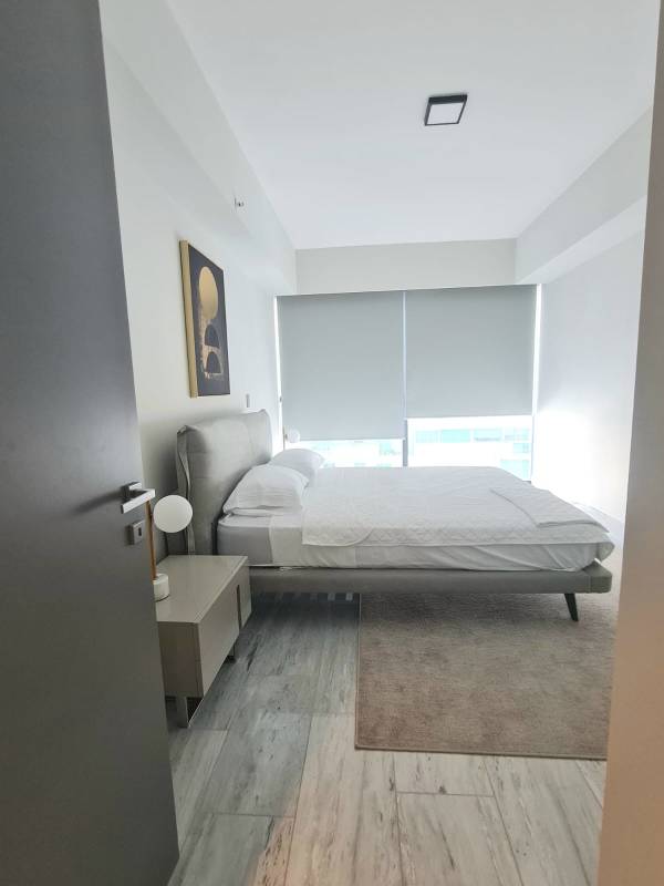 Spacious furnished master bedroom with city views at PH Nuovo by Artmani Panama City