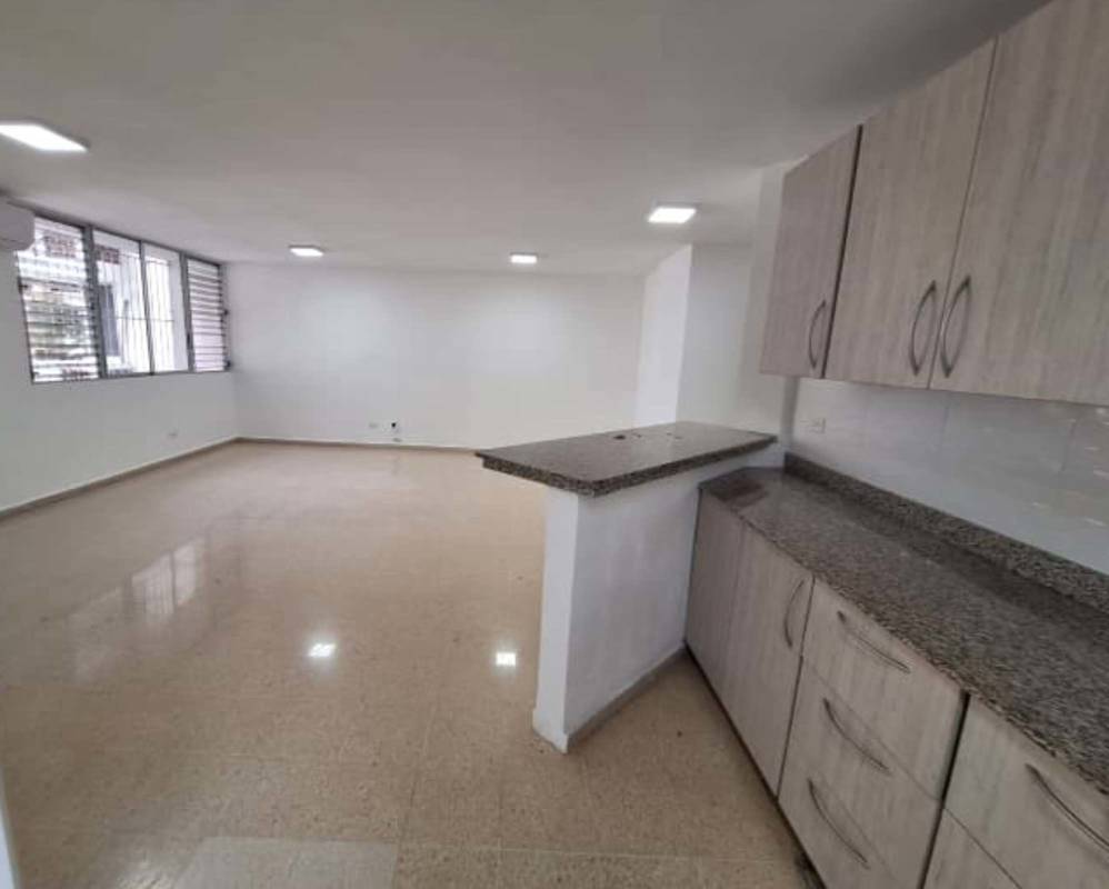 Modern kitchen with granite counters and wood cabinets apartment PH Royal Plaza El Carmen Panama