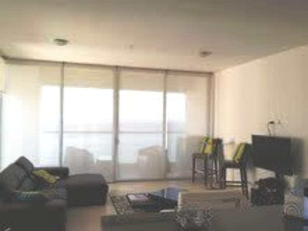 Rooftop oceanview infinity pool surrounded by palm trees at PH BICSA Financial Center Panama City