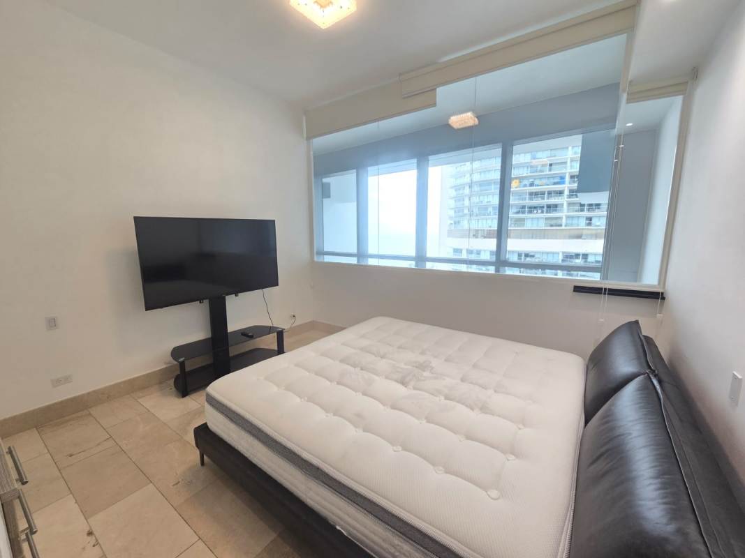 Minimalist bedroom city skyline view marble floor Punta Pacífica Grand Tower apartment