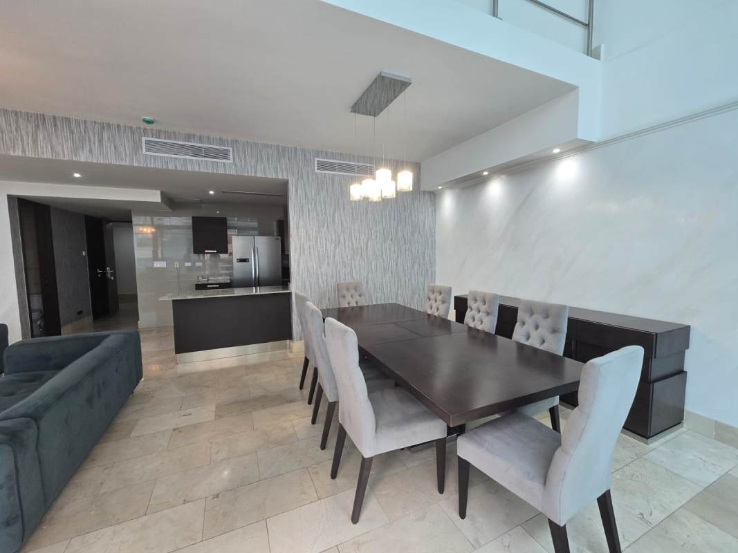 Spacious dining space with marble flooring and modern lighting in Grand Tower Punta Pacífica Panama