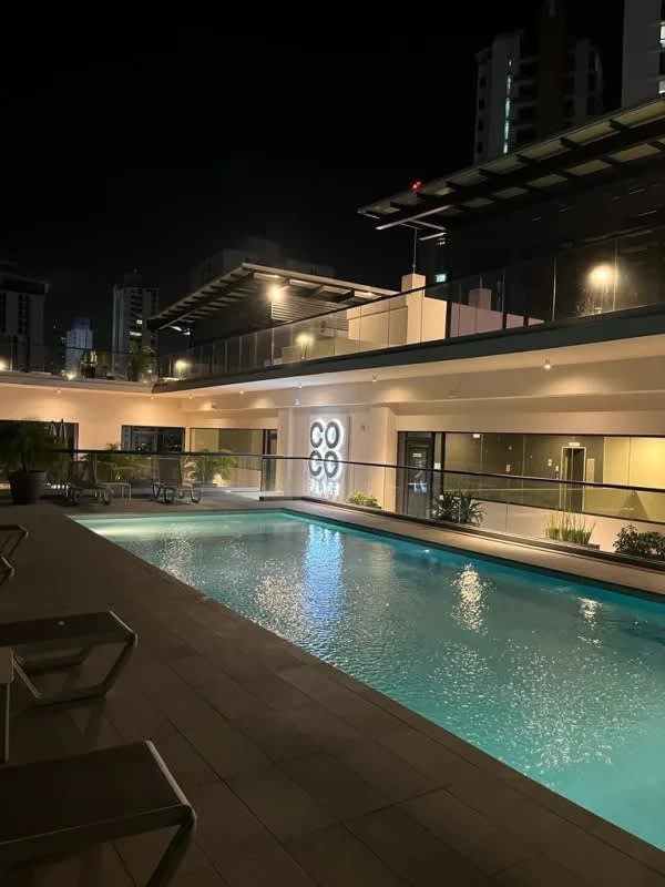 Contemporary kitchen with appliances, quartz countertops and breakfast bar at PH Coco del Mar Panama