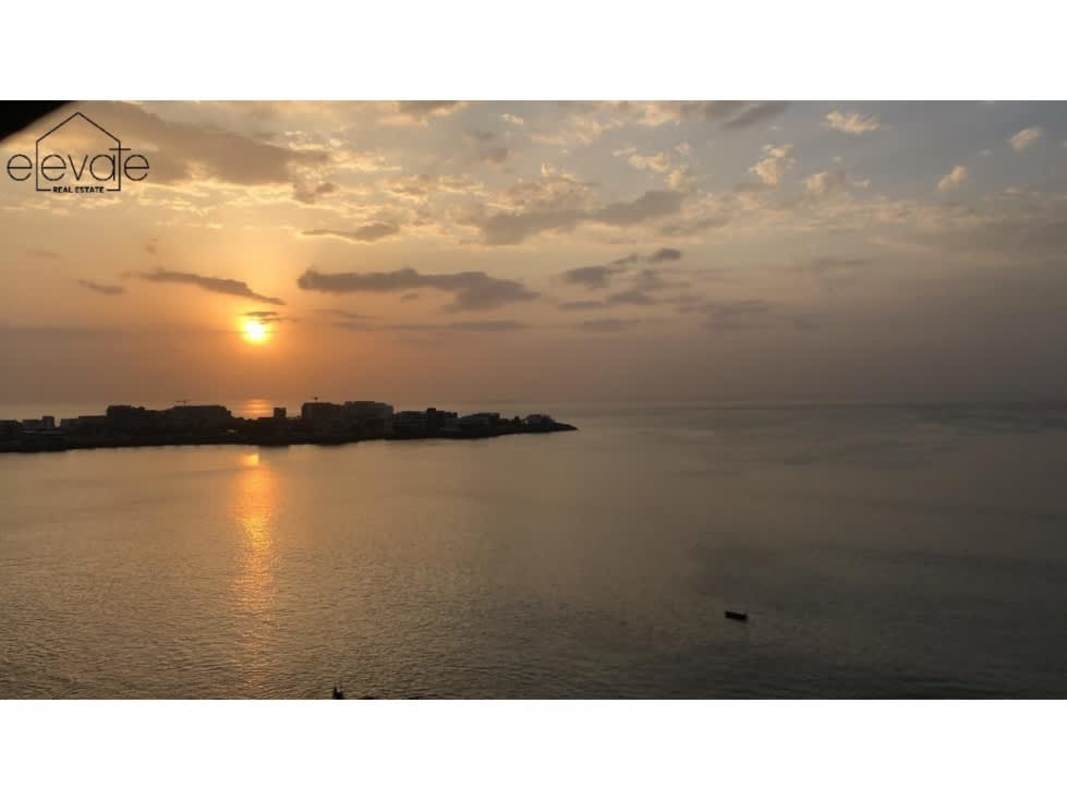 Master bedroom with large window and ocean view in PH Bahía Mar Punta Paitilla Panama City