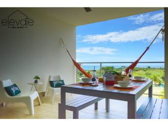 Bedroom with sliding doors to balcony ocean view Casamar golf resort Panama