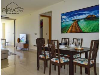 Infinity pool with jacuzzis, palm trees, high-rise condos Casamar beach resort Panama