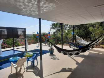 Spacious bedroom with tile flooring at country home in El Higo Panama