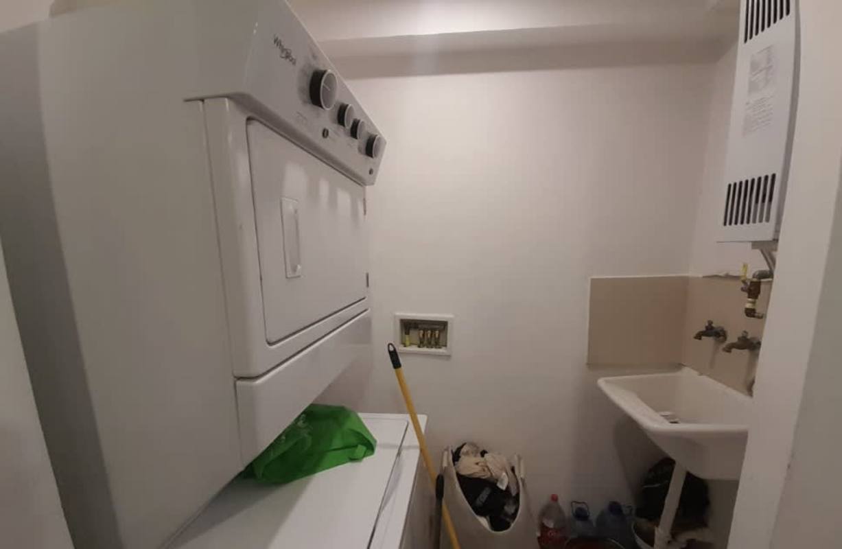 Laundry room with washer dryer hookups and sink in PH Liberty Tower Panama City