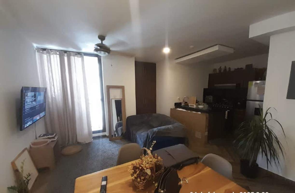 Open-concept living with bed, dining, TV, kitchen at PH Liberty Tower Panama City