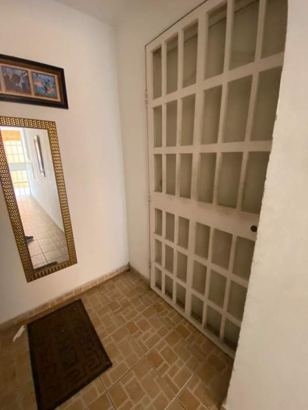 Apartment entrance with security door and wall mirror PH Valencia Bethania Panama