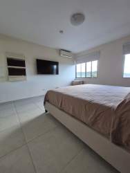 Furnished living dining room balcony AC porcelain tile floors apartment for rent Panama Pacifico