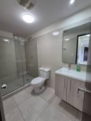 Bathroom with glass shower vanity porcelain tile PH Mosaic Panama Pacifico rental apartment
