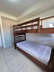 Furnished second bedroom built-in closet AC tile flooring PH Mosaic apartment Panama Pacifico