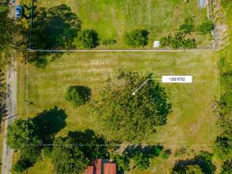 Drone overhead image of fenced property with greenery and flat terrain in San Carlos Panama close to Pacific beach