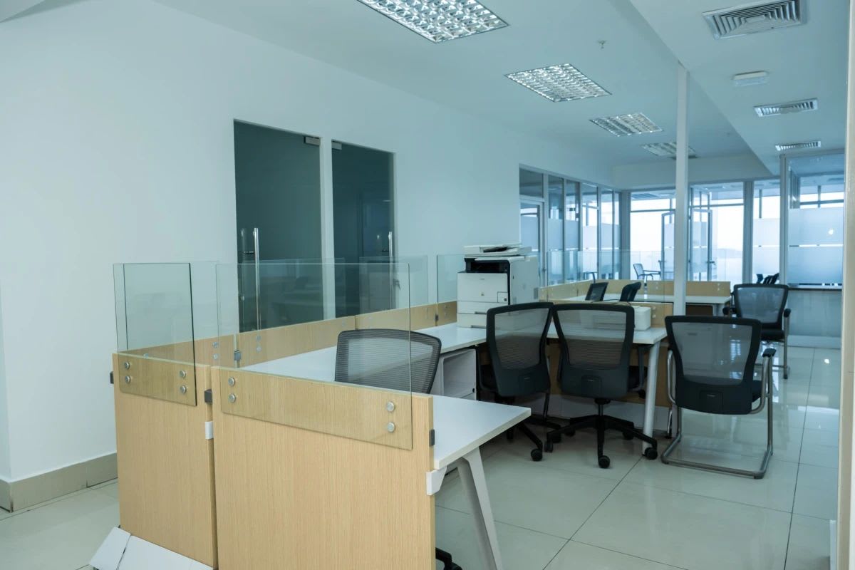 Private glass-enclosed office with ergonomic furniture at BICSA Tower Panama City