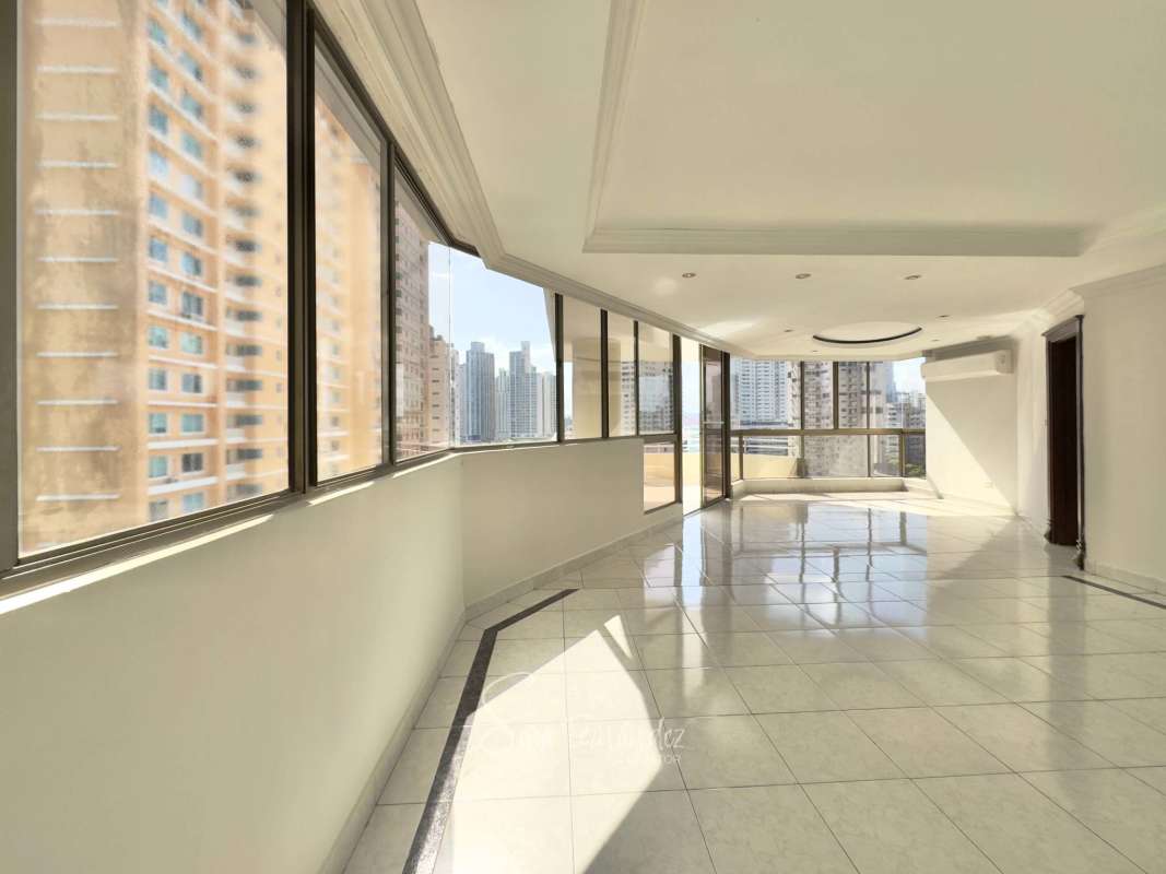 Modern living room with ceramic floors and large windows at PH Avenida Balboa Panama