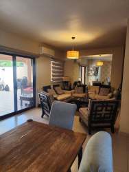 Modern open plan living dining room with sliding glass doors in duplex for sale Panama Pacifico