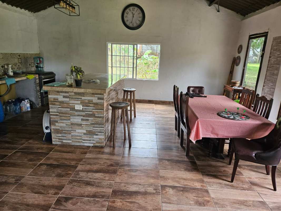 Rustic covered porch connected to BBQ garden area at El Valle de San Martín Panama