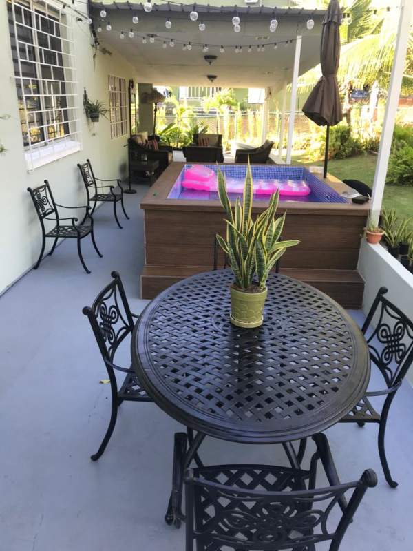 Covered backyard patio with pool in Diablo Heights Panama house for sale