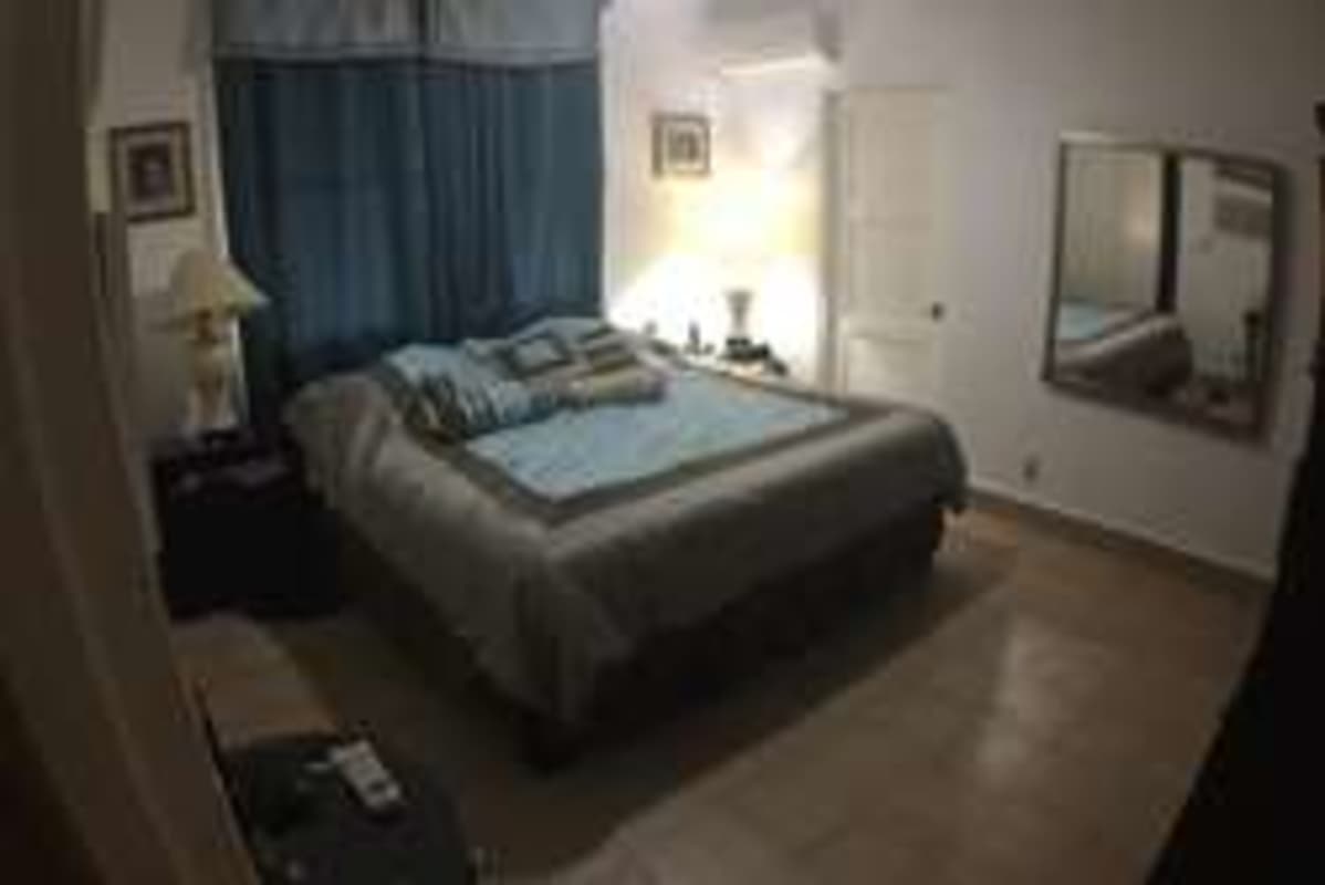 Traditional bedroom with double bed and blue curtains for sale Diablo Heights
