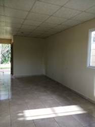 Empty living room tiled floor, large window minimalist affordable house La Mitra La Chorrera