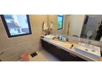 Community resort-style swimming pool and lounge at Nativa Panama Pacifico residential complex