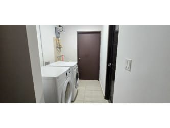 Covered terrace and backyard garden area in Nativa Panama Pacifico rental house