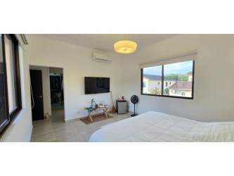 Luxury bathroom with modern vanity and shower in Nativa Panama Pacifico community house