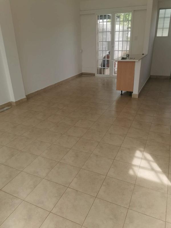 Open plan living dining space with tiled floors, large window Brisas del Lago Panama