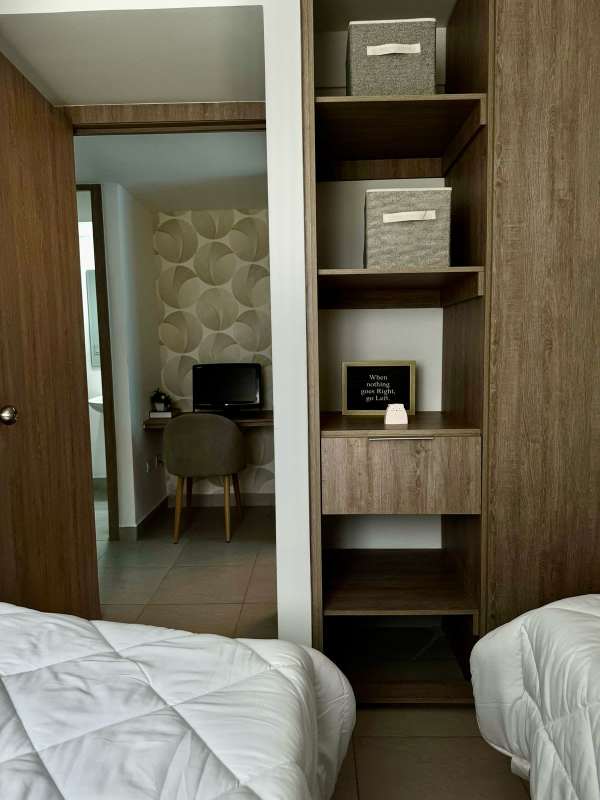 Swimming pool with jacuzzi lounge chairs landscaped deck in PH Los Pueblos Tower Panama