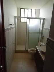 Bedroom with sliding doors to balcony, ocean view, ceiling fan and AC at PH Ocean Front Gorgona Panama