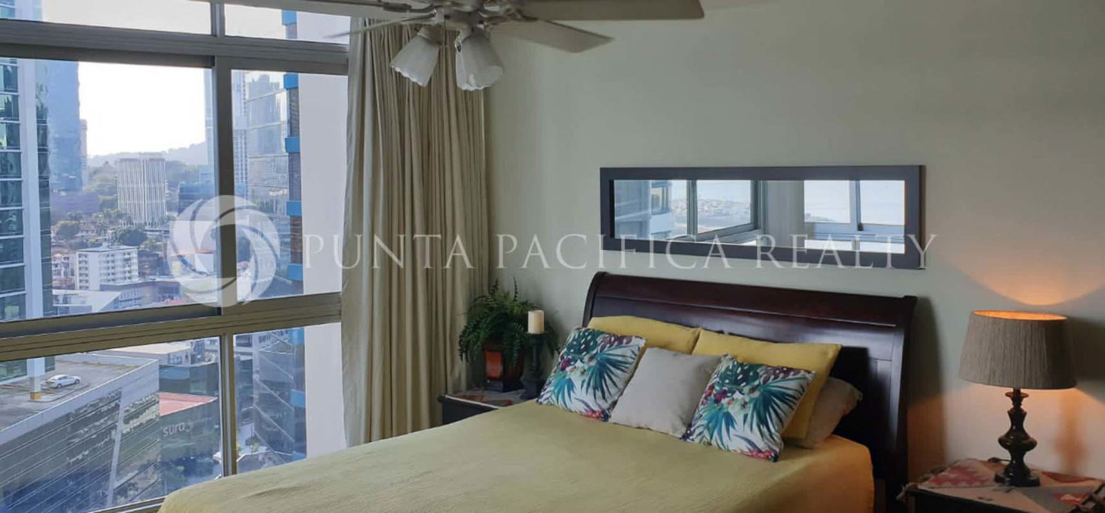 King-size bedroom furnished, city skyline panoramic windows PH Bayfront apartment rental in Panama
