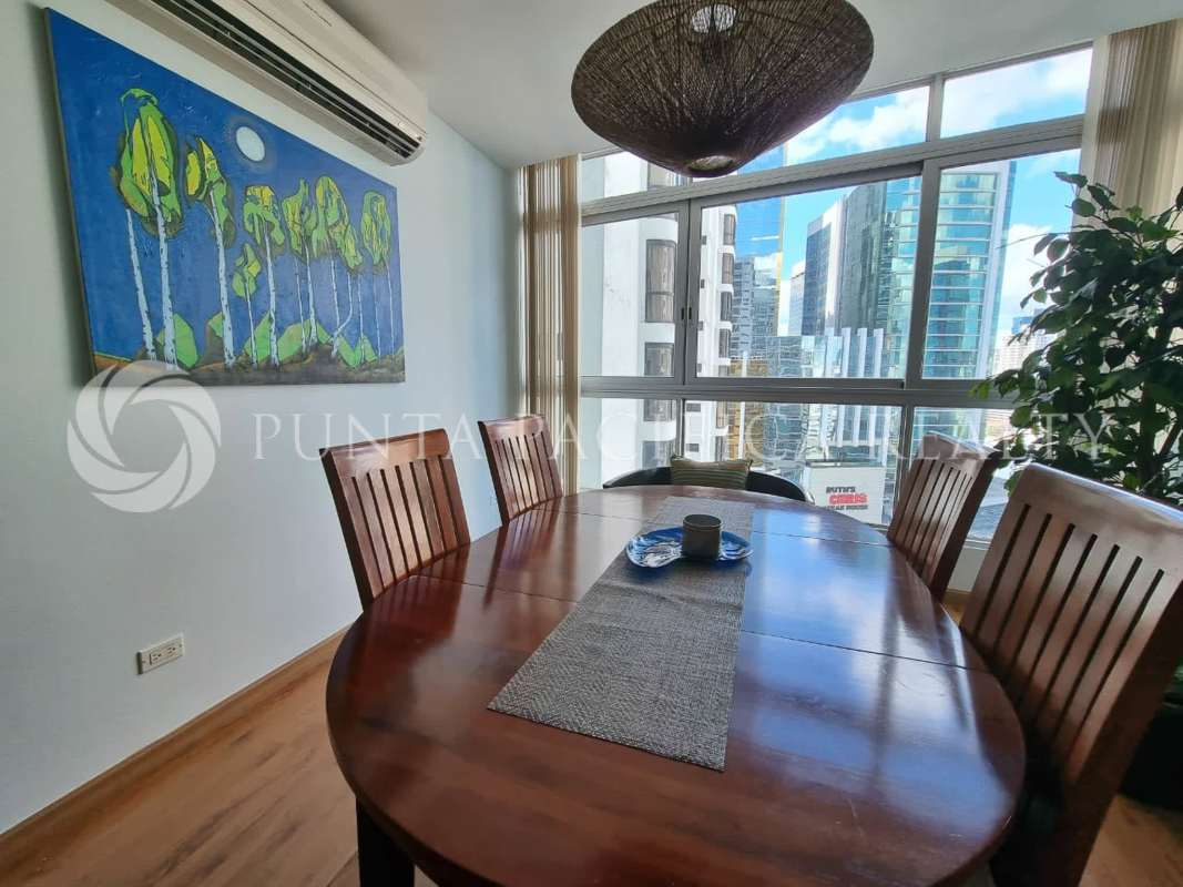 Large window dining area with cityscape views furnished at PH Bayfront Panama