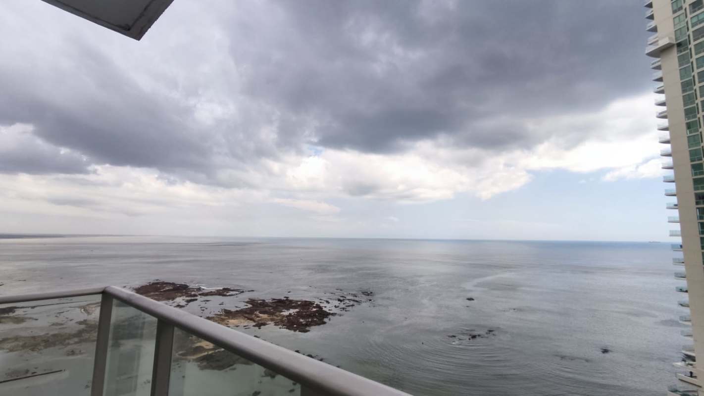 Elegant master suite with floor-to-ceiling ocean facing windows in PH Dupont Punta Pacifica