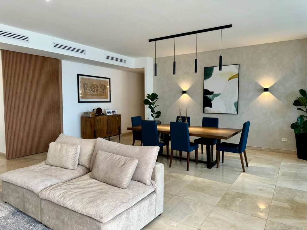 Open concept living and dining with panoramic city skyline view at PH Aqualina Punta Pacífica