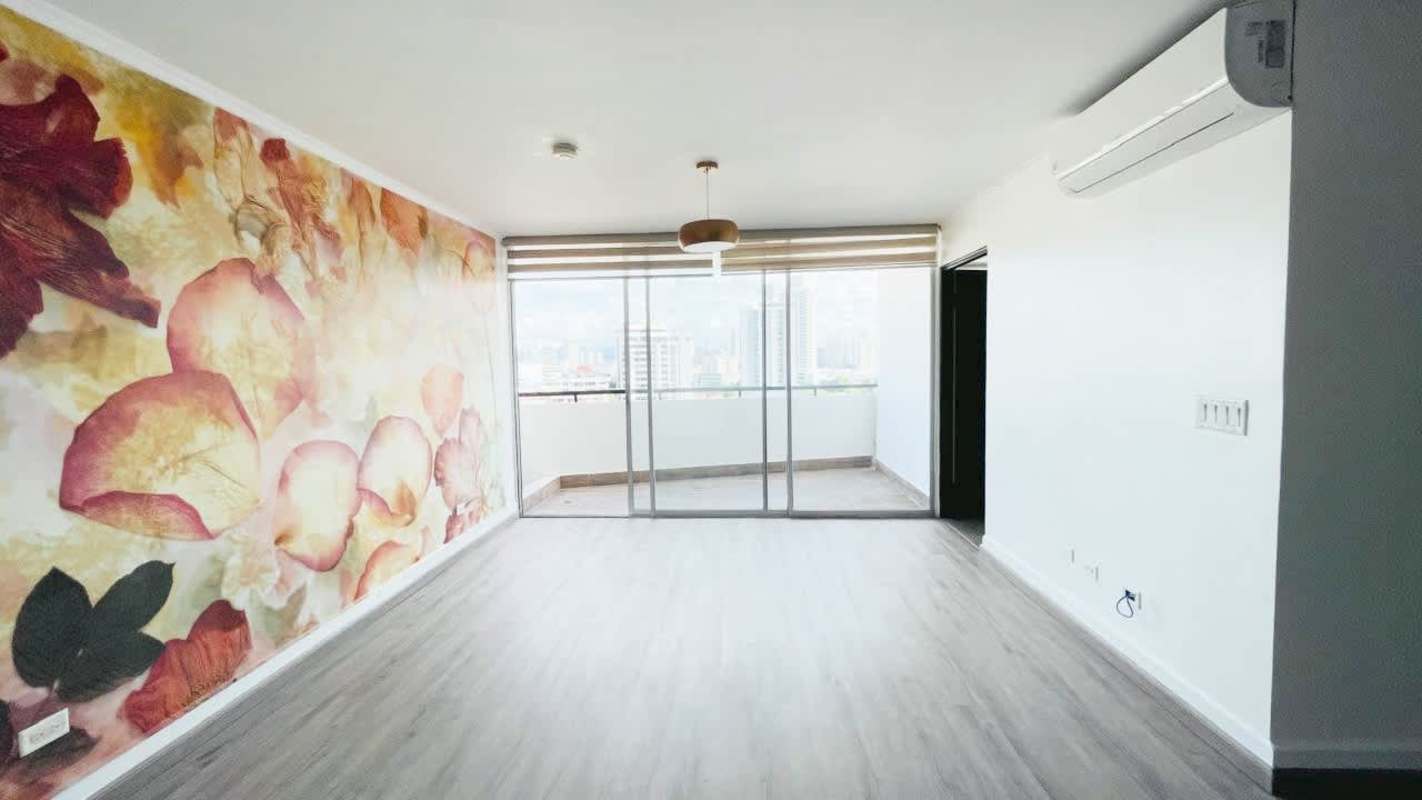 Elegant living room with floral mural, AC, balcony, wood flooring at PH El Carmen Tower Panama