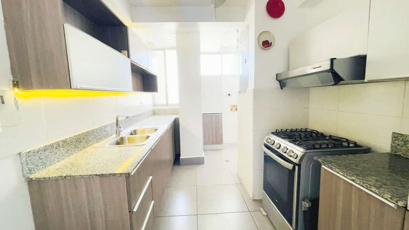 Contemporary kitchen with granite countertops, gas stove, tile backsplash at PH El Carmen Tower