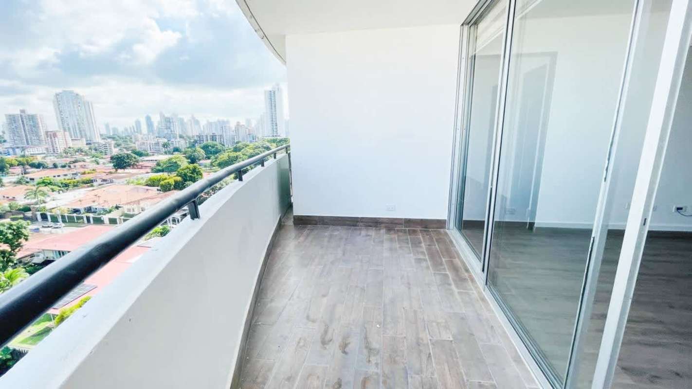 Spacious modern balcony with skyline views, wood tile floor at PH El Carmen Tower Panama City