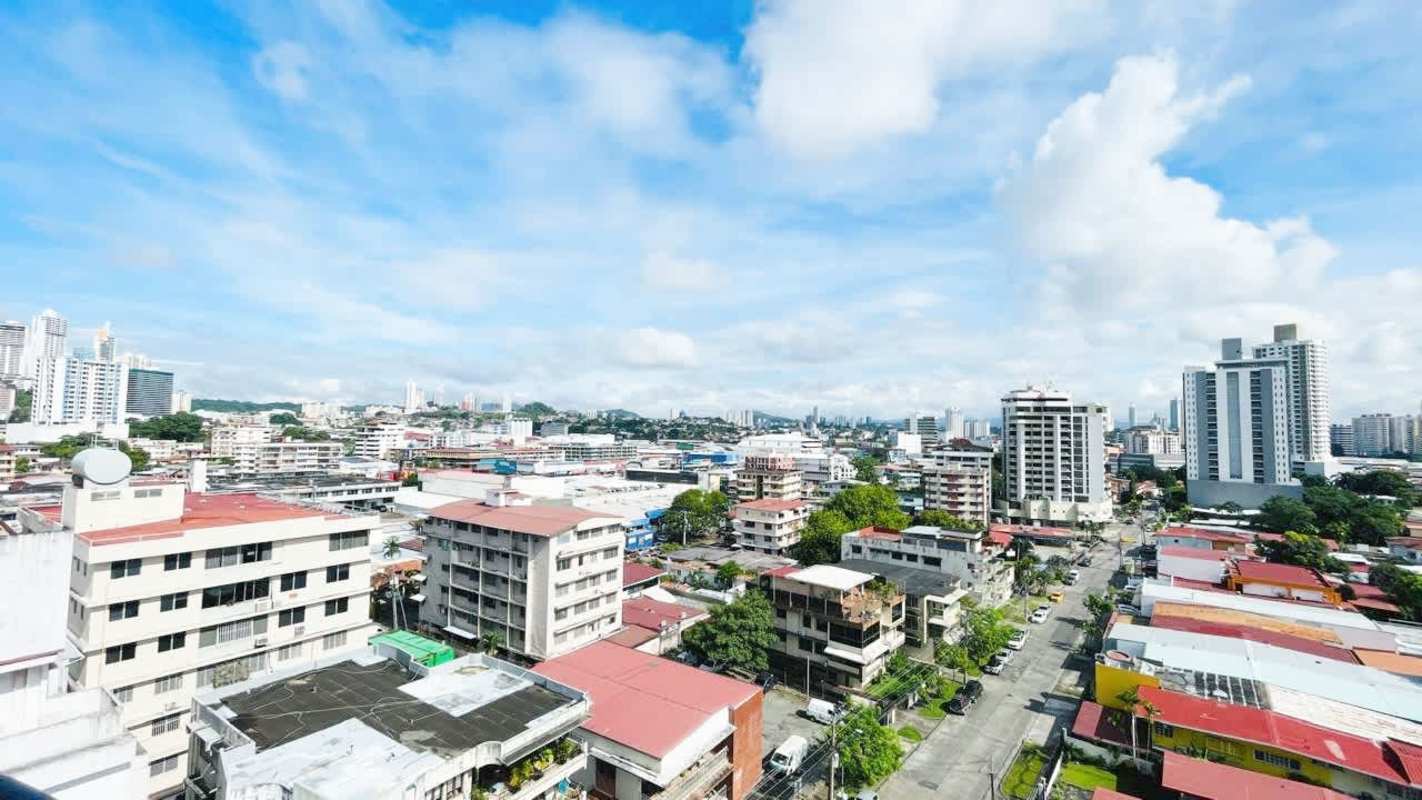 Aerial view with mid-rise and high-rise buildings, Panama skyline, green areas in El Carmen