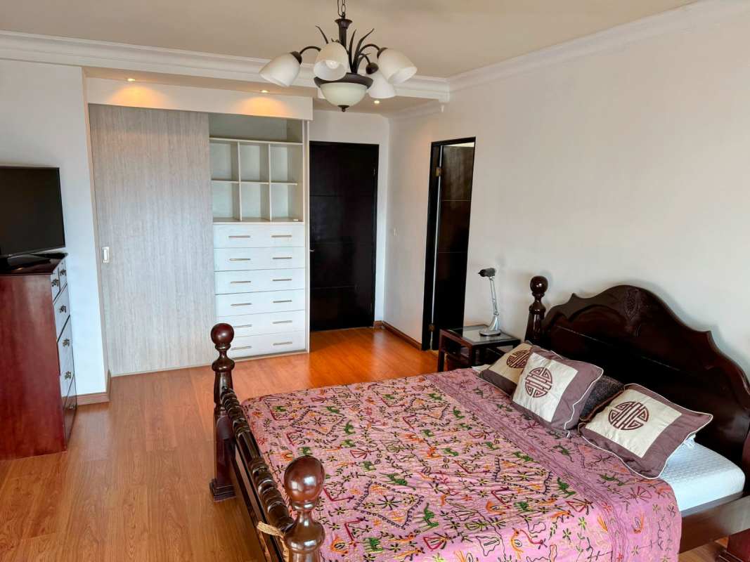 Bedroom featuring built-in closet split AC wood floors PH The View Panama