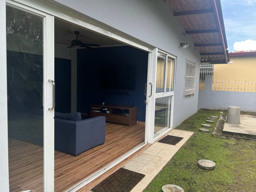 Sliding glass door from living area to garden in Lomas del Golf Panama
