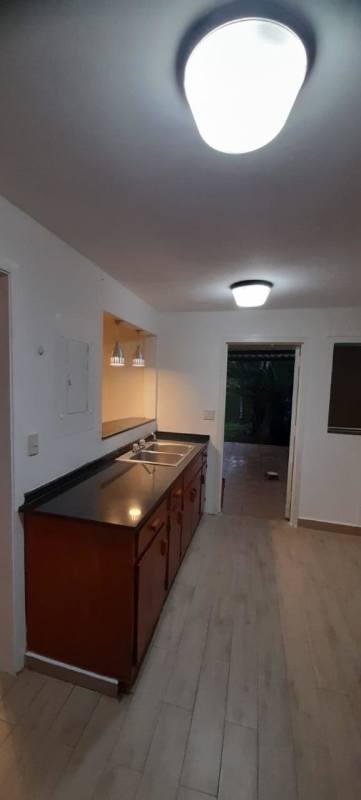 Master bedroom featuring ensuite bathroom, large windows, garden view, ground floor Clayton