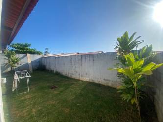 Private fenced backyard with green lawn and trees in Álamos Arboledas Panama Oeste