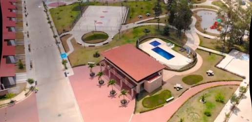 Aerial of residential community with clubhouse, pool, sports court, gardens in Álamos Arboledas Panama