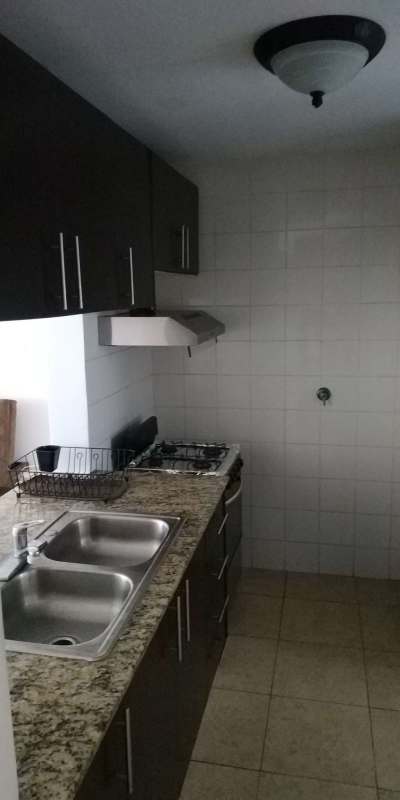 Compact kitchen with granite counter, double sink, gas stove, PH Transistmica Panama