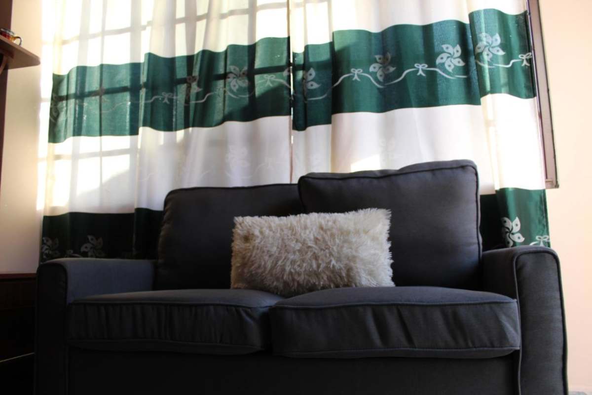 Kitchenette area with appliances in furnished studio at PH Condado Gardens Altos de Panamá