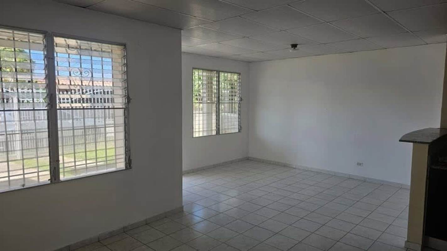 Bedroom with window, built-in closet and tile floor in house for sale Panama City