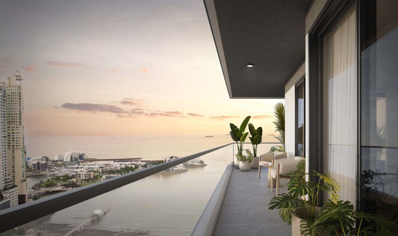 Modern high-rise balcony with panoramic view of ocean and city at sunset in Punta Pacifica Panama