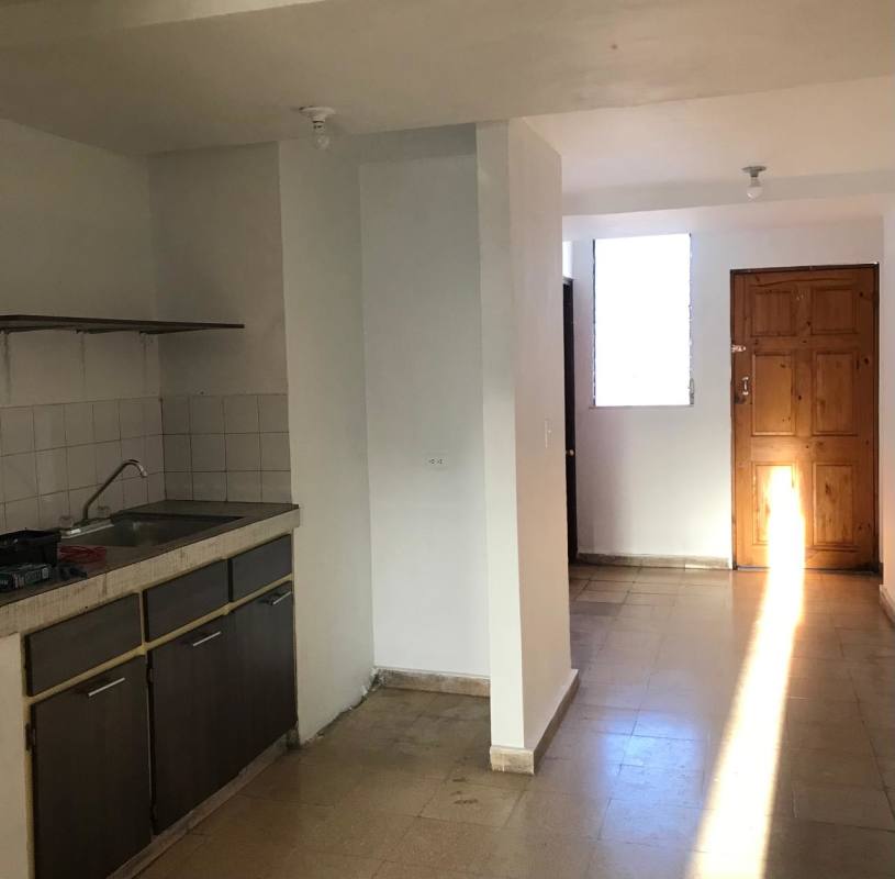 Street view of PH Avenida B with storefront, balconies, residential apartments in Santa Ana Panama
