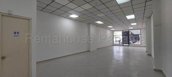 Commercial bathroom with sink, toilet, mirror and tiled walls Plaza La Chorrera Panama Oeste